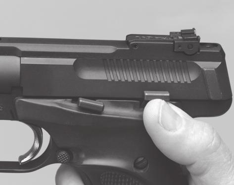 Figure 2 Figure 3 To release the slide when no magazine is in the pistol and the slide is locked rearward, the slide release/stop latch must be pressed downward.