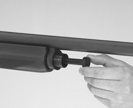 2 Holding the receiver in one hand, and the barrel in the other, ease the barrel forward off the magazine tube and out of the receiver.