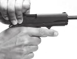 2 If the safety is in the on safe position, move it down into the off safe position. 3 With your fingers away from the trigger, pull the slide completely to the rear and release it.