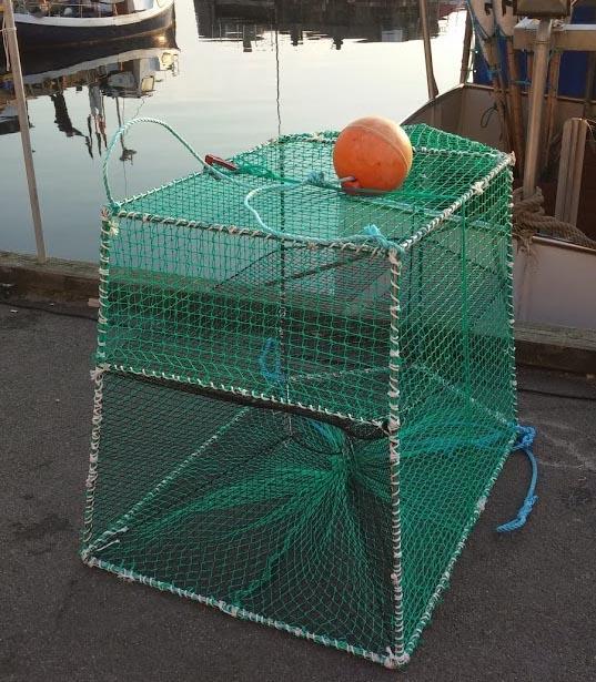 and seals. Figure 5. A prototype of a smaller pontoon fish chamber with the trap net on a raft for easy transport to the fishing grounds.