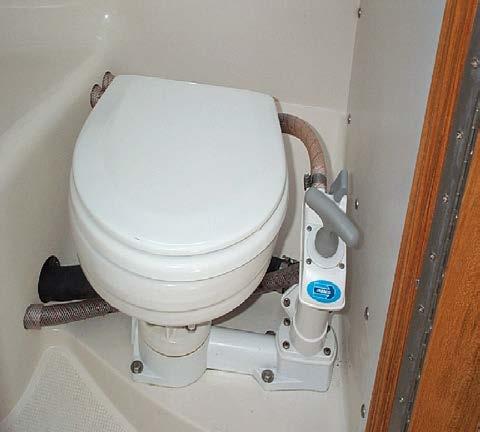 B. SANITATION SYSTEM Marine Head (Toilet) The head contains a vanity with sink, a showerhead, and a marine toilet with hand operated pump for flushing.