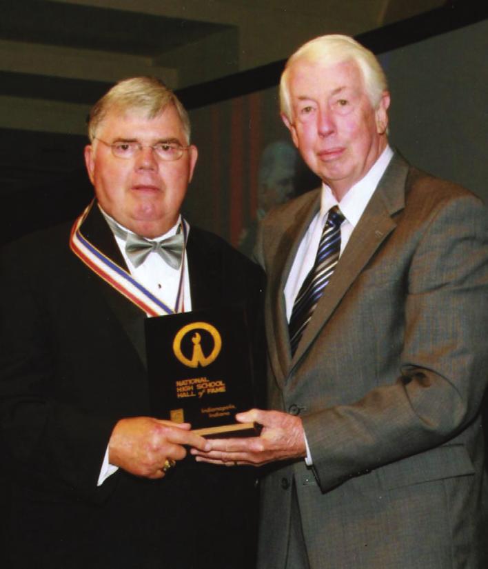 National Hall of Famer Jerry McGee of Elizabeth City, left, displays his National High School Hall of Fame award with NCHSAA executive director Charlie Adams.