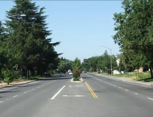 Access is limited, crossings are generally signalized at grade, parking is prohibited, and a continuous median separates lanes in opposite directions. Arterials.