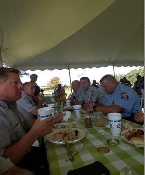 Officers from DNR LE and Georgia State Patrol enjoying a BBQ meal at the legislative luncheon in Coffee County.