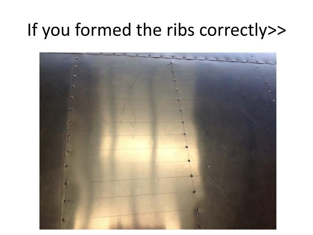 All the ribs are the same so once you get your spacing for rivets on the FLAT areas of the ribs you just mark from one end to the other and draw a line to keep the row straight.