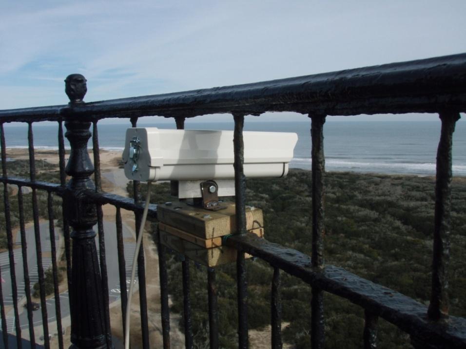 Figure 5: Camera securely attached to the railing of the Cape Hatteras Lighthouse using a custom fabricated mount.