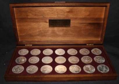 Estimate $400-600 607 Danbury Mint Men In Space Se ries, twenty one ster ling sil ver rounds in proof con di tion, in wooden box, at trac tive lot, please visit, Ex tremely Fine.