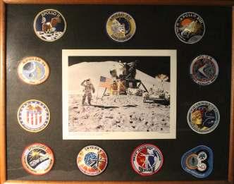 WORLD AEROPHILATELY: Space Flights 612 NASA Patch Col lec tion, eleven of fi cial patches and a color photo framed and un der glass, 29" by 23", patches in clude Apollo II, Apollo XII, Apollo XIII,
