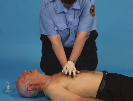 Open the airway, and give two ventilations of 1 second each. Perform five cycles of chest compressions and ventilations.