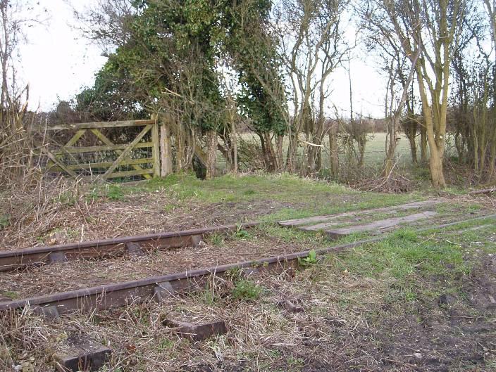 A fairly remote area of the line with open fields on either side. Photo 3260112 The first of two farm crossings linking fields belonging to Sheepway Gate Farm.