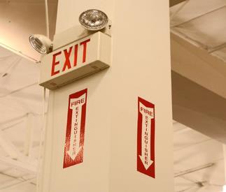 NEVER block an emergency exit or fire suppression device.