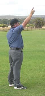 When it is a straight sub (one player for another) the umpire will signal by holding both arms shoulder width apart and move them up and down (Photo 39).
