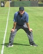 UMPIRE POSITIONS AND SIGNALS 1. SET POSITION (Photo 1) Set feet shoulder width apart with a slight heel-to-toe stagger. Place hands on knees, bend in the legs and lower the seat.