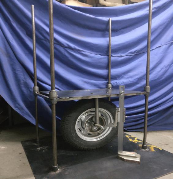 Analysis of Two Wheeler Tyre Using motion of the loading platform. This was achieved by using four linear bearings. The tyre was fitted below the loading platform using two rigid mild steel bars.
