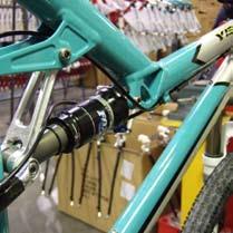 Take another piece of housing and secure it in the second stop on the nondrive side of the top tube. Run the housing over the shock into the stop on the drive side seatstay.