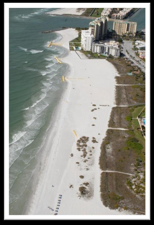 have reduced erosion by approximately 40% as compared to losses after the previous nourishment and to have no clear impact on the downdrift beach.