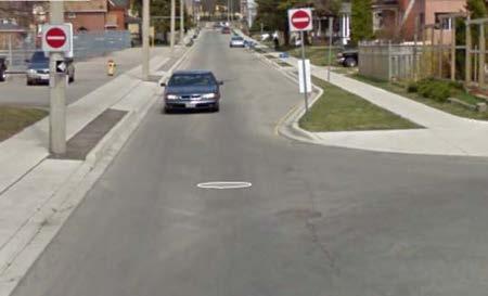 Page 24 of 34 Figure 10 Road Diet, Mississauga, ON Raised median through intersection.
