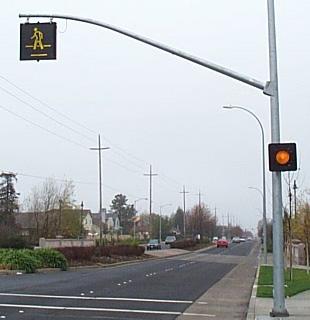 OVERHEAD SIGNS AND FLASHING BEACONS Overhead signs and flashing beacons are additional methods of increasing the visibility of a crosswalk.