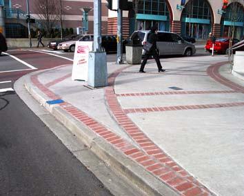 combination with a raised crosswalk and/or a median island. In addition to their pedestrian safety benefits, curb extensions on one or both sides of the roadway also help to reduce vehicle speeds.