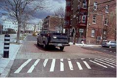 5. Raised Intersections equivalent to speed tables, only they are applied over the entire intersection with ramps on all sides. They are normally at or near the same elevation as the sidewalk.