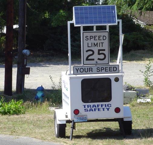 RADAR SPEED TRAILER A portable trailer equipped with a radar unit detects the speed of passing vehicles and displays it on a digital reader board.