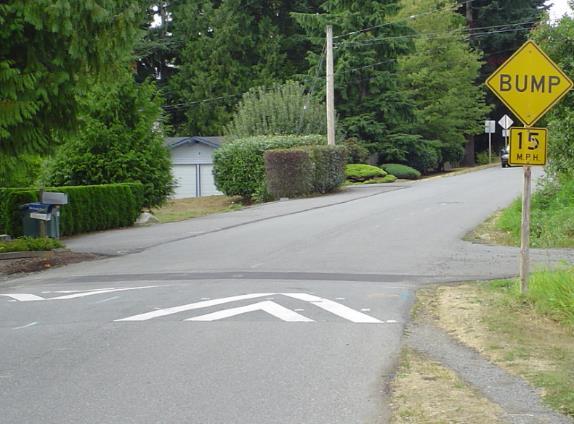 locations along a street corridor. SPEED HUMPS A raised area of road, approximately 3 inches high and either 12 or 22 feet long.
