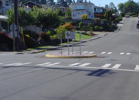 A 10-foot wide crosswalk is marked on top of the raised pavement to form a Raised Crosswalk.