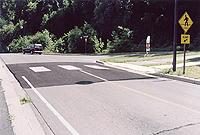 placed across roadway. Speed humps are typically 12' long (in the direction of travel), 3"- 4" high, parabolic shaped, with a design speed of 15-20 mph.