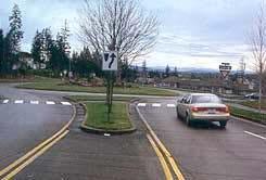 safety are problems. Roundabouts require traffic to circulate counterclockwise around a center island.
