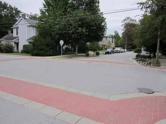 Drivers typically slow down when crossing textured pavement due to vibration created by the pavement surface.