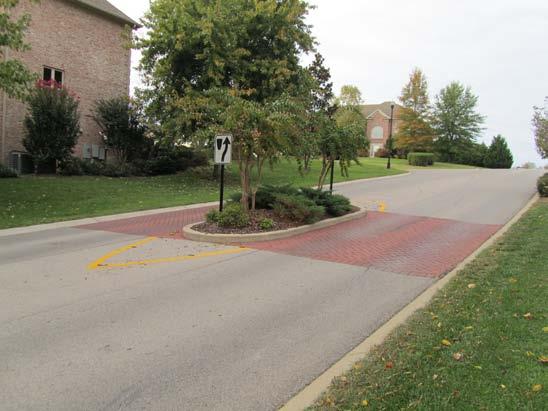 The medians are often landscaped to provide visual amenity; they can also contain curb extensions that consist of concrete curbing, a line of bollards, or any other obstruction deemed appropriate.