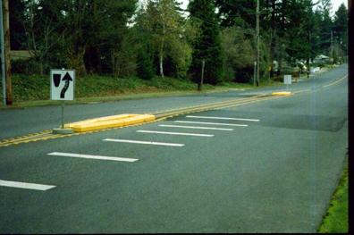 SPLIT SPEED HUMP Split speed humps are a variation of the speed hump. Each approach of the speed hump is separated by approximately 50 feet.