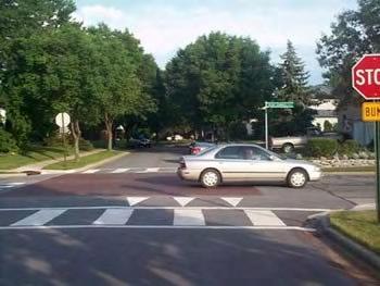 By modifying the level of the intersection, the crosswalks are more readily perceived by motorists to be a pedestrian area.