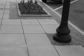 These sidewalks can either be installed detached from the street and separated by a landscaped planting strip or attached to the street with a concrete curb and