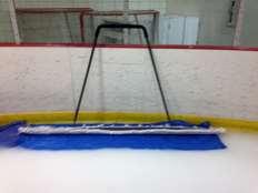 3. After every two to three swipes down the length of the ice, shake the mop at the boards to release any accumulated snow/particulate. Figure 3.