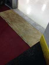 1 shows an example of a cart with stones. Figure 5.1: Stones on a Cart To help get the stones on the ice, a wooden ramp should be placed between the ice and floor as seen in Figure 5.2.