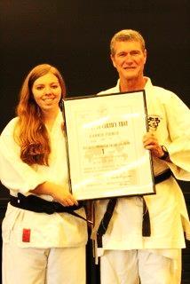 Below: Carrie Pierce (with Mark Cramer) earned her Shodan from the Seiwa Kai in 2014, and will become the first Toledo School for the Arts student to receive an Arts Diploma for the Martial Arts in