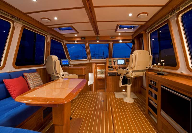 The main cabin includes Stidd seats at the helm and chart table, for comfort and visibility.