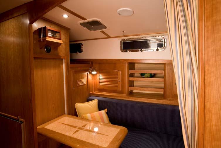 Opposite the galley is the `extra cabin with a handsome