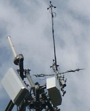 A picture of the setup is below note the horizontal booms where the anemometers and vanes are attached: Figure 2- Instrumentation at top of Yankee Network Tower note the