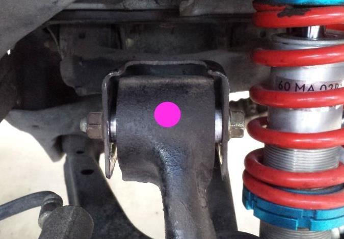 You can install the fitting in the bottom, in the hole marked by the pink dot, if your suspension doesn t droop enough to have