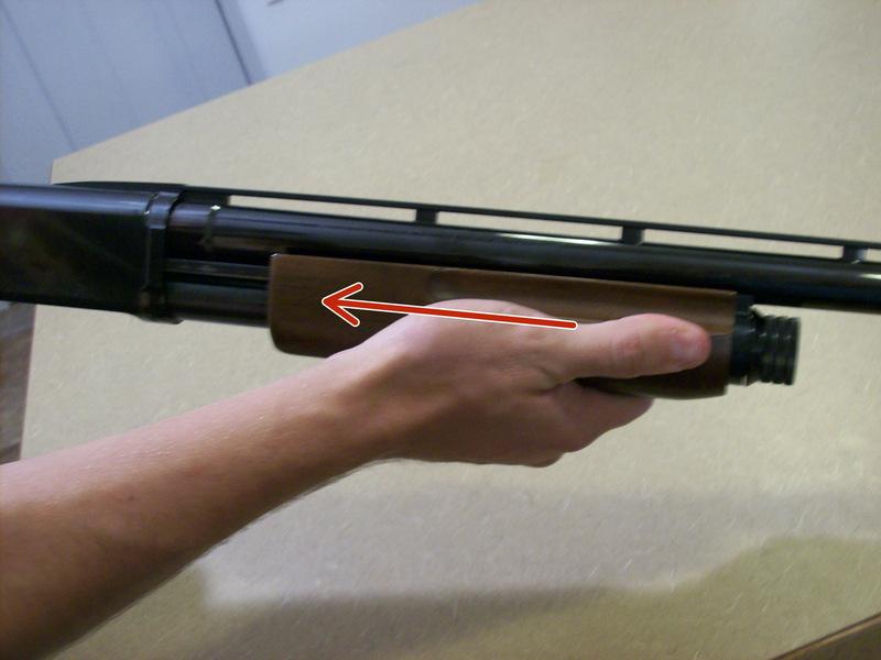 Push the fore grip forward until it is locked in position. This will load any rounds in the magazine into the chamber.