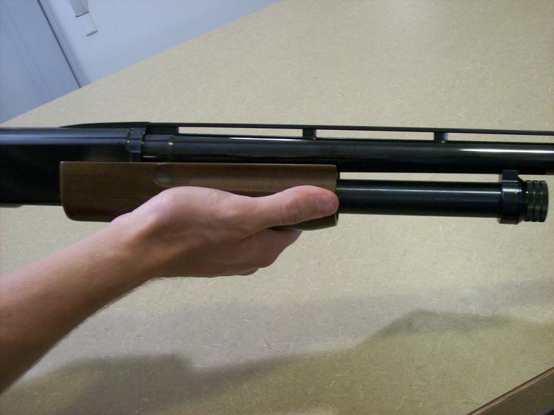 Magazine: The metal tube under the barrel, where the extra rounds are held until they are loaded to be fired or removed.