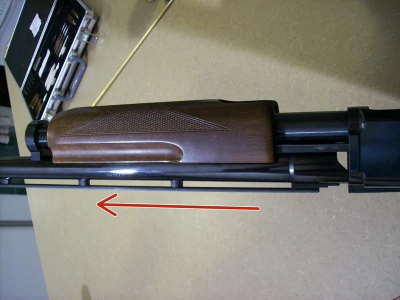 Remove the magazine cap by unscrewing it.