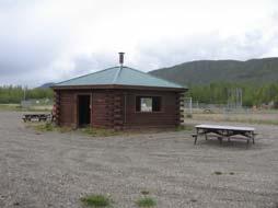 A set of pit privies is located on the north side of the most westerly diamond. There are also several picnic tables around the diamonds. There are no formal dugouts.