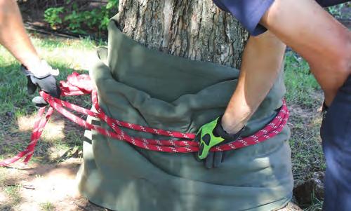 NOTE: The water knot should be tight on the anchor object and be located in the middle of the sling created by pulling on the two bights of webbing.