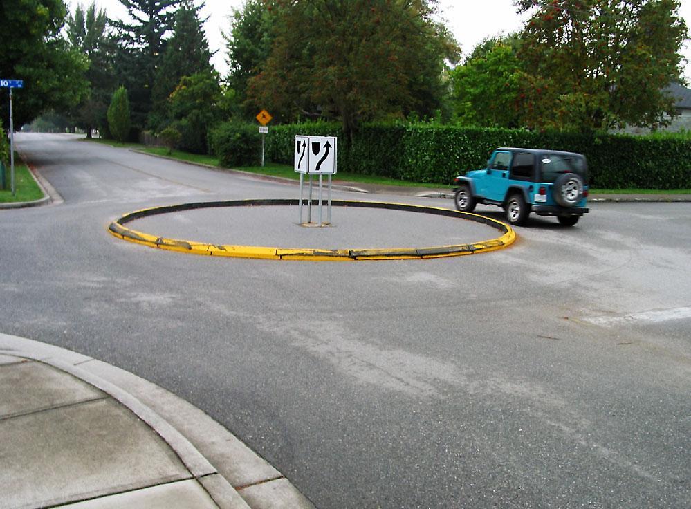 Figure 22 Temporary Traffic Circle Implementation of the Traffic Calming Plan would begin with the construction of speed humps as well as appropriate signage and pavement markings.