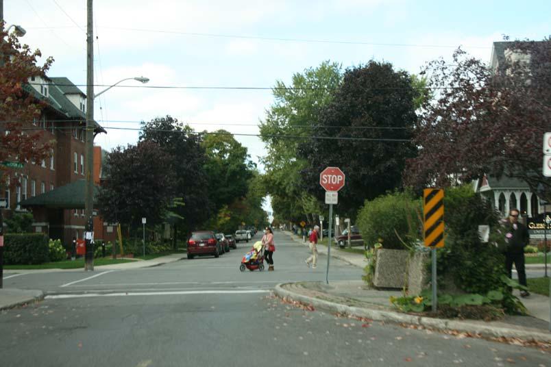 Page 16 6. Photos Sightlines and Visibility The vegetation planters installed at this Ottawa intersection can easily obscure the driver s view of a pedestrian waiting to cross the street.