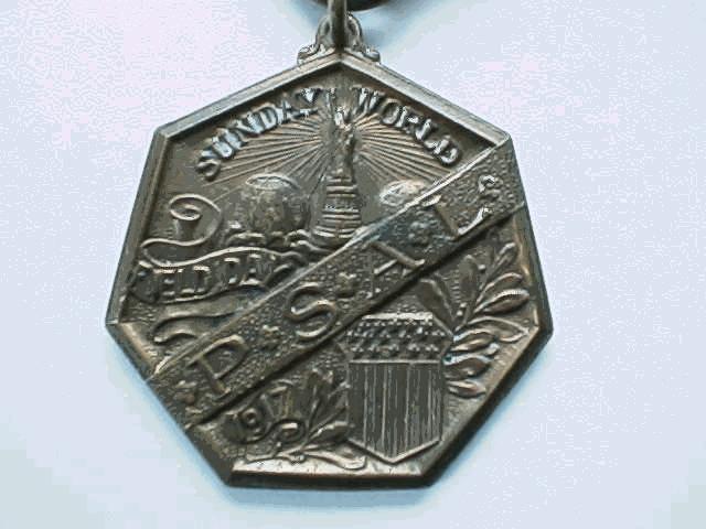 only 1916 STERLING SILVER VARIETY Obverse: Above: Pulitzer Newspaper logo of the Statue of Liberty between two globes, sitting on a cartouche. SUNDAY//WORLD Center: In exergue P.S.//A.L. on each side of the New York State coat of arms.