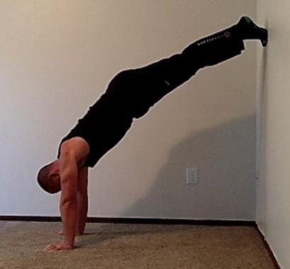 From this position press your lower back into the ground and lift your legs off the ground about 2 inches.